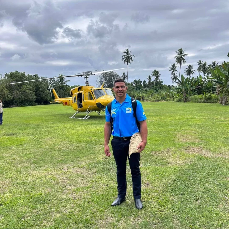 David Mead standing infront of a helicopter wearing SBBF shirt
